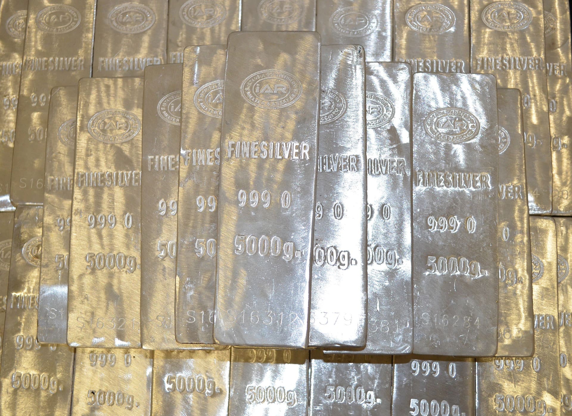 Several stacked silver bars